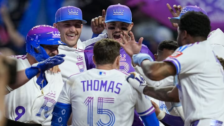 Apr 26, 2026; Kansas City, Missouri, USA; Kansas City Royals center fielder Lane Thomas (15) celebrates with teammates after hitting a walk-off home run during the tenth inning against the Los Angeles Angels at Kauffman Stadium. Mandatory Credit: Jay Biggerstaff-Imagn Images