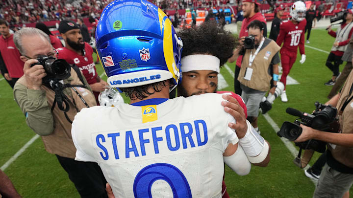 Arizona Cardinals quarterback Kyler Murray (1) and Los Angeles Rams quarterback Matthew Stafford (9) embrace at midfield after their game on Sept. 15, 2024, at State Farm Stadium in Glendale. Arizona Cardinals quarterback Kyler Murray (1) and Los Angeles Rams quarterback Matthew Stafford (9) embrace at midfield after their game on Sept. 15, 2024, at State Farm Stadium in Glendale.