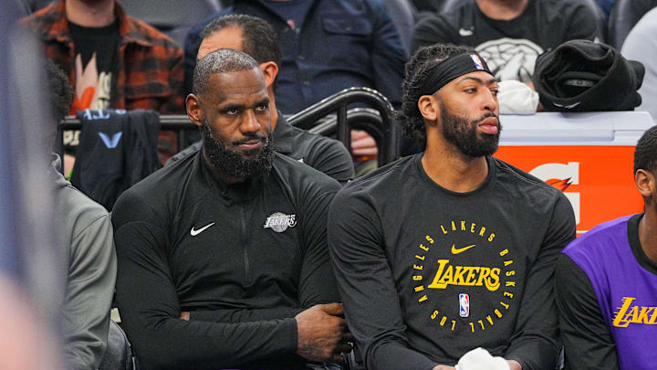 Dec 2, 2024; Minneapolis, Minnesota, USA; Los Angeles Lakers forward LeBron James (23) and forward Anthony Davis (3) on the bench against the Minnesota Timberwolves in the fourth quarter at Target Center. Mandatory Credit: Brad Rempel-Imagn Images