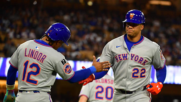Jun 3, 2025; Los Angeles, California, USA; New York Mets outfielder Juan Soto (22) reacts with shortstop Francisco Lindor (12) after hitting a two run home run against the Los Angeles Dodgers during the third inning at Dodger Stadium. Mandatory Credit: Gary A. Vasquez-Imagn Images Jun 3, 2025; Los Angeles, California, USA; New York Mets outfielder Juan Soto (22) reacts with shortstop Francisco Lindor (12) after hitting a two run home run against the Los Angeles Dodgers during the third inning at Dodger Stadium. Mandatory Credit: Gary A. Vasquez-Imagn Images