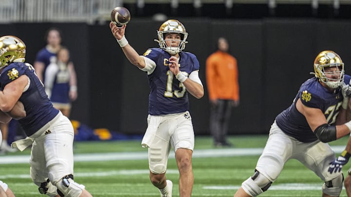 Oct 19, 2024; Atlanta, Georgia, USA; Notre Dame Fighting Irish quarterback Riley Leonard (13) passes against the Georgia Tech Yellow Jackets at Mercedes-Benz Stadium. Mandatory Credit: Dale Zanine-Imagn Images