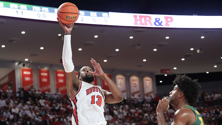Feb 10, 2025; Houston, Texas, USA;  Houston Cougars forward J'Wan Roberts (13) shoots against Baylor Bears forward Norchad Omier (15) in the first half at Fertitta Center. Mandatory Credit: Thomas Shea-Imagn Images