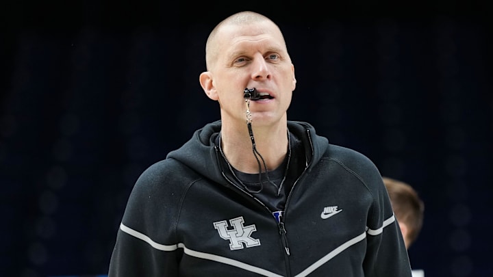 Kentucky Wildcats head coach Mark Pope walks onto the court Thursday, March 27, 2025, during practice ahead of the Sweet 16 March Madness tournament game against the Tennessee Volunteers at Lucas Oil Stadium in Indianapolis.