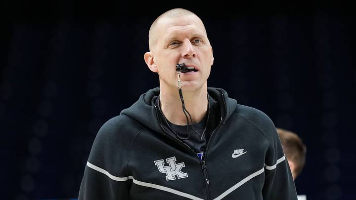 Kentucky Wildcats head coach Mark Pope walks onto the court Thursday, March 27, 2025, during practice ahead of the Sweet 16 March Madness tournament game against the Tennessee Volunteers at Lucas Oil Stadium in Indianapolis. Kentucky Wildcats head coach Mark Pope walks onto the court Thursday, March 27, 2025, during practice ahead of the Sweet 16 March Madness tournament game against the Tennessee Volunteers at Lucas Oil Stadium in Indianapolis.