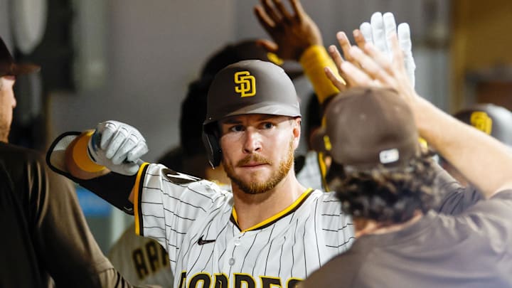Aug 18, 2025; San Diego, California, USA; San Diego Padres pitch hitter Ryan O'Hearn (32) celebrates in the dugout after hitting a two-run home run during the seventh inning against the San Francisco Giants at Petco Park. Mandatory Credit: David Frerker-Imagn Images Aug 18, 2025; San Diego, California, USA; San Diego Padres pitch hitter Ryan O'Hearn (32) celebrates in the dugout after hitting a two-run home run during the seventh inning against the San Francisco Giants at Petco Park. Mandatory Credit: David Frerker-Imagn Images