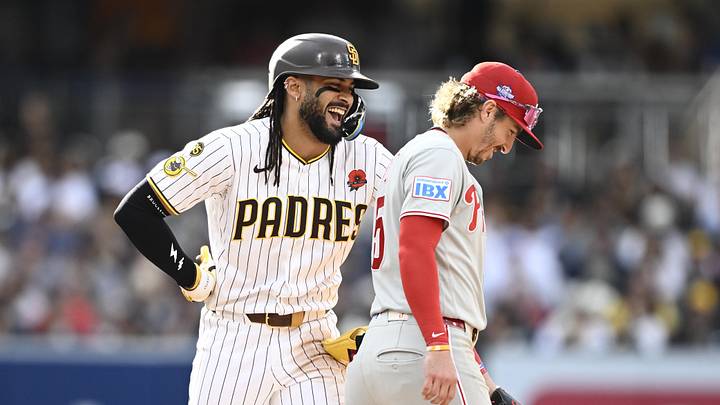 May 25, 2026; San Diego, California, USA; San Diego Padres second baseman Fernando Tatis Jr. (23) reacts with Philadelphia Phillies second baseman Bryson Stott (5) during the eighth inning at Petco Park. Mandatory Credit: Denis Poroy-Imagn Images