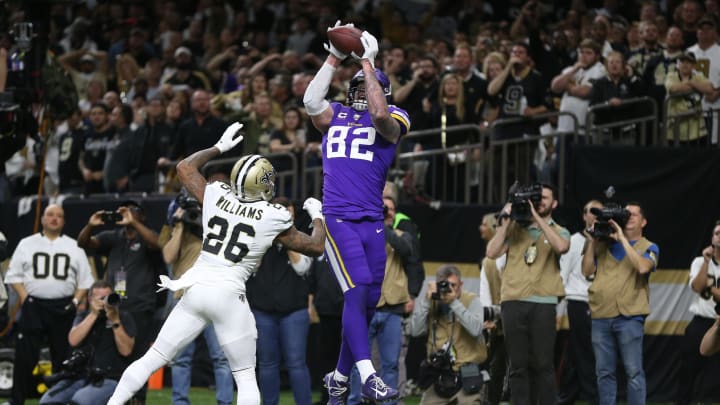 Minnesota Vikings tight end Kyle Rudolph (82) catches a pass for the winning touchdown over New Orleans Saints cornerback P.J. Williams (26) during overtime of a NFC Wild Card playoff game at the Mercedes-Benz Superdome in New Orleans on Jan. 5, 2020.