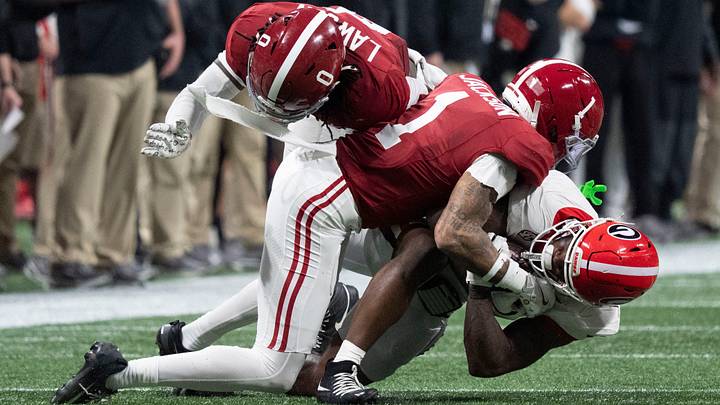Dec 6, 2025; Atlanta, GA, USA; Alabama linebacker Deontae Lawson (0) and Alabama defensive back Domani Jackson (1) combine to Dec 6, 2025; Atlanta, GA, USA; Alabama linebacker Deontae Lawson (0) and Alabama defensive back Domani Jackson (1) combine to