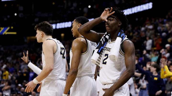 March 20, 2025; Denver, CO, USA; Michigan Wolverines guard L.J. Cason (2) reacts from the bench during the second half against the UC San Diego Tritons at Ball Arena. March 20, 2025; Denver, CO, USA; Michigan Wolverines guard L.J. Cason (2) reacts from the bench during the second half against the UC San Diego Tritons at Ball Arena.