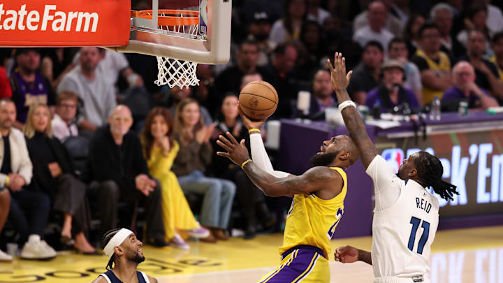 Apr 22, 2025; Los Angeles, California, USA; Los Angeles Lakers forward LeBron James (23) goes to the basket against Minnesota Timberwolves center Naz Reid (11) during the fourth quarter of game two of first round for the 2024 NBA Playoffs at Crypto.com Arena. Mandatory Credit: Kiyoshi Mio-Imagn Images Apr 22, 2025; Los Angeles, California, USA; Los Angeles Lakers forward LeBron James (23) goes to the basket against Minnesota Timberwolves center Naz Reid (11) during the fourth quarter of game two of first round for the 2024 NBA Playoffs at Crypto.com Arena. Mandatory Credit: Kiyoshi Mio-Imagn Images