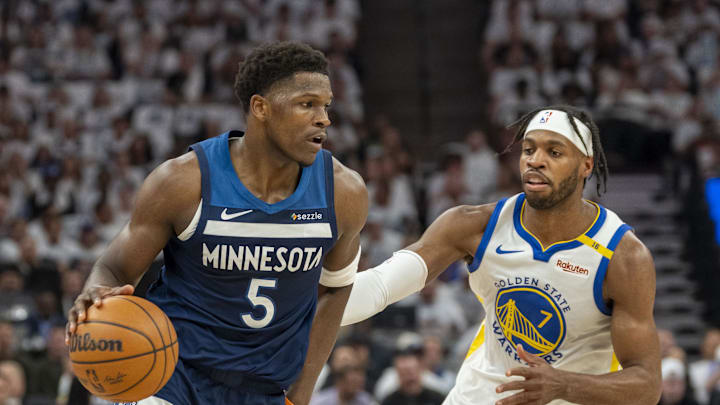 May 14, 2025; Minneapolis, Minnesota, USA; Minnesota Timberwolves guard Anthony Edwards (5) dribbles the ball past Golden State Warriors guard Buddy Hield (7) in the first half during game five of the second round for the 2025 NBA Playoffs at Target Center. Mandatory Credit: Jesse Johnson-Imagn Images May 14, 2025; Minneapolis, Minnesota, USA; Minnesota Timberwolves guard Anthony Edwards (5) dribbles the ball past Golden State Warriors guard Buddy Hield (7) in the first half during game five of the second round for the 2025 NBA Playoffs at Target Center. Mandatory Credit: Jesse Johnson-Imagn Images