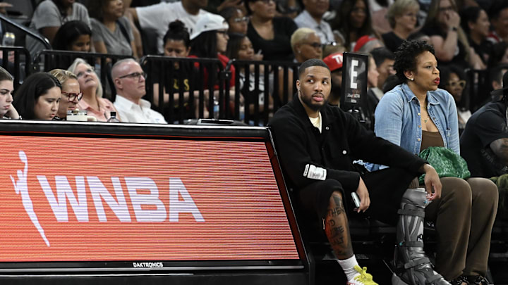 May 30, 2025; Las Vegas, Nevada, USA; NBA player Damian Lillard sits courtside during the Las Vegas Aces and Los Angeles Sparks game at Michelob Ultra Arena. Mandatory Credit: Candice Ward-Imagn Images