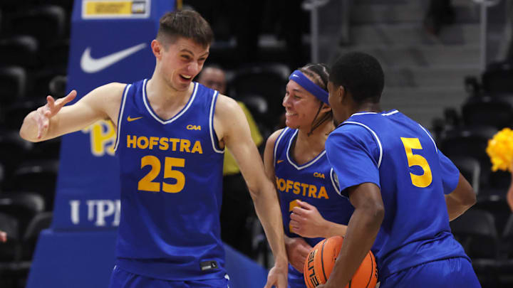 Dec 7, 2025; Pittsburgh, Pennsylvania, USA; Hofstra Pride guard German Plotnikov (25) and guard Preston Edmead (middle) and guard Cruz Davis (5) celebrate after defeating the Pittsburgh Panthers at the Petersen Events Center. Mandatory Credit: Charles LeClaire-Imagn Images