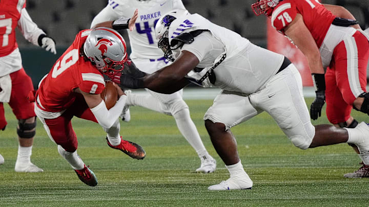 Dec 6, 2024; Birmingham, AL, USA; Parker's Jourdin Crawford (0) makes a tackle on Saraland's KJ Lacey (9) at Protective Stadium in the 6A State Championship game.