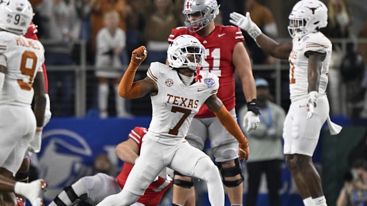 Jan 10, 2025; Arlington, Texas, USA; Texas Longhorns defensive back Jahdae Barron (7) celebrates after a sack during the second quarter of the College Football Playoff semifinal against the Ohio State Buckeyes in the Cotton Bowl at AT&T Stadium. Mandatory Credit: Jerome Miron-Imagn Images