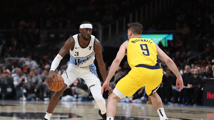 Mar 8, 2025; Atlanta, Georgia, USA; Atlanta Hawks guard Caris LeVert (3) dribbles defended by Indiana Pacers guard T.J. McConnell (9) during the first quarter at State Farm Arena. Mandatory Credit: Mady Mertens-Imagn Images
