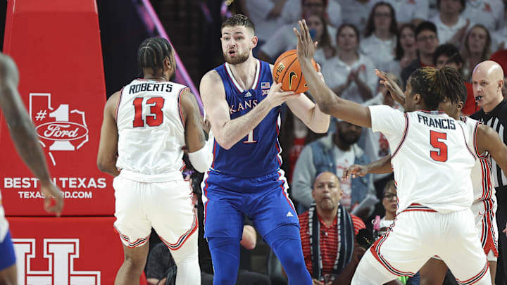 Mar 9, 2024; Houston, Texas, USA; Kansas Jayhawks center Hunter Dickinson (1) controls the ball as Houston Cougars forward J'Wan Roberts (13) and forward Ja'Vier Francis (5) defend during the game at Fertitta Center. Mandatory Credit: Troy Taormina-Imagn Images Mar 9, 2024; Houston, Texas, USA; Kansas Jayhawks center Hunter Dickinson (1) controls the ball as Houston Cougars forward J'Wan Roberts (13) and forward Ja'Vier Francis (5) defend during the game at Fertitta Center. Mandatory Credit: Troy Taormina-Imagn Images