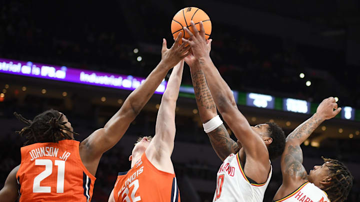 Mar 14, 2025; Indianapolis, IN, USA; Illinois Fighting Illini forward Morez Johnson Jr. (21), Illinois Fighting Illini guard Kasparas Jakucionis (32), Maryland Terrapins forward Julian Reese (10) and Maryland Terrapins guard DeShawn Harris-Smith (5) go for a rebound during the first half at Gainbridge Fieldhouse. Mandatory Credit: Robert Goddin-Imagn Images
