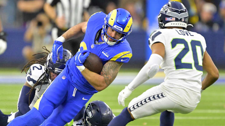 Jan 5, 2025; Inglewood, California, USA; Los Angeles Rams tight end Tyler Higbee (89) runs for a first down before he is stopped by Seattle Seahawks safety Rayshawn Jenkins (2) and linebacker Ernest Jones IV (13) in the second half at SoFi Stadium. Mandatory Credit: Jayne Kamin-Oncea-Imagn Images