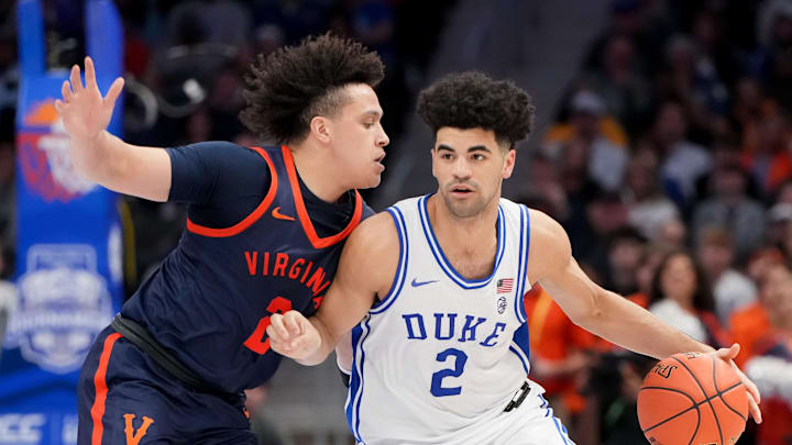 Mar 14, 2026; Charlotte, NC, USA; Duke Blue Devils guard Cayden Boozer (2) dribbles against Virginia Cavaliers guard Chance Mallory (2) during the men's ACC Conference Tournament Championship at Spectrum Center. Mandatory Credit: Bob Donnan-Imagn Images Mar 14, 2026; Charlotte, NC, USA; Duke Blue Devils guard Cayden Boozer (2) dribbles against Virginia Cavaliers guard Chance Mallory (2) during the men's ACC Conference Tournament Championship at Spectrum Center. Mandatory Credit: Bob Donnan-Imagn Images
