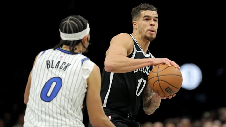 Jan 7, 2026; Brooklyn, New York, USA; Brooklyn Nets forward Michael Porter Jr. (17) controls the ball against Orlando Magic guard Anthony Black (0) during the third quarter at Barclays Center. Mandatory Credit: Brad Penner-Imagn Images
