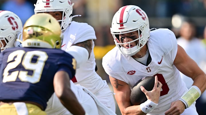 Oct 12, 2024; South Bend, Indiana, USA; Stanford Cardinal quarterback Justin Lamson (8) runs for a touchdown in the first quarter against the Notre Dame Fighting Irish at Notre Dame Stadium. Mandatory Credit: Matt Cashore-Imagn Images