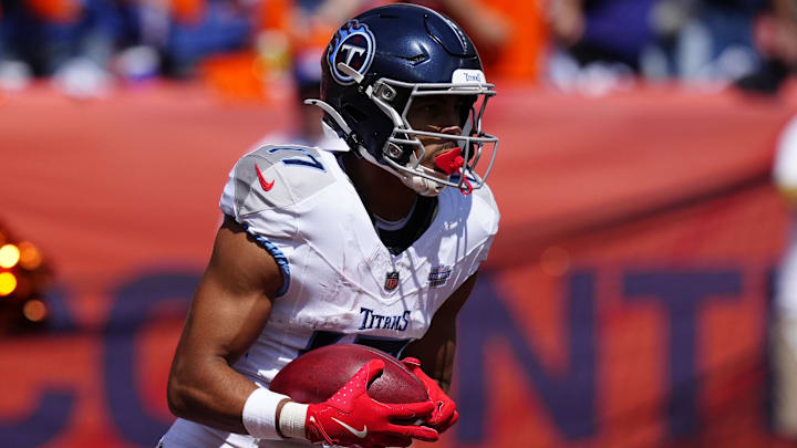 Tennessee Titans wide receiver Chimere Dike returns a kick off against the Denver Broncos.