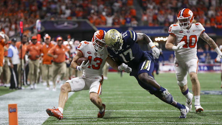 Sep 5, 2022; Atlanta, Georgia, USA; Clemson Tigers wide receiver Brannon Spector (13) is tackled by Georgia Tech Yellow Jackets linebacker Demetrius Knight II (17) in the second quarter at Mercedes-Benz Stadium. Mandatory Credit: Brett Davis-Imagn Images