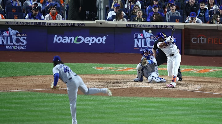 Oct 18, 2024; New York City, New York, USA; New York Mets right fielder Starling Marte (6) hits a double on a pitch from Los Angeles Dodgers pitcher Brent Honeywell (40) during the sixth inning during game five of the NLCS for the 2024 MLB playoffs at Citi Field. Mandatory Credit: Wendell Cruz-Imagn Images