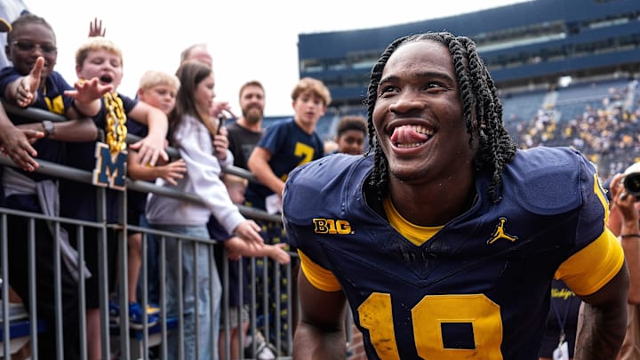 Michigan quarterback Bryce Underwood (19) smiles at fans as he walks up the tunnel after 63-3 win over Central Michigan at Michigan Stadium in Ann Arbor on Saturday, Sept. 13, 2025.