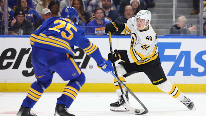 Apr 19, 2026; Buffalo, New York, USA; Buffalo Sabres defenseman Owen Power (25) tries to block a shot by Boston Bruins center James Hagens (44) during the third period in game one of the first round of the 2026 Stanley Cup Playoffs at KeyBank Center. Mandatory Credit: Timothy T. Ludwig-Imagn Images