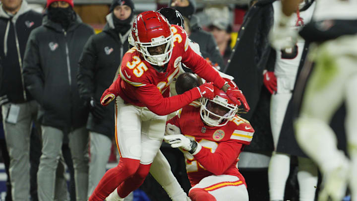 Jan 18, 2025; Kansas City, Missouri, USA; Kansas City Chiefs cornerback Jaylen Watson (35) and safety Justin Reid (20) break up a pass intended for Houston Texans wide receiver Nico Collins (12) during the fourth quarter of a 2025 AFC divisional round game at GEHA Field at Arrowhead Stadium. Mandatory Credit: Jay Biggerstaff-Imagn Images Jan 18, 2025; Kansas City, Missouri, USA; Kansas City Chiefs cornerback Jaylen Watson (35) and safety Justin Reid (20) break up a pass intended for Houston Texans wide receiver Nico Collins (12) during the fourth quarter of a 2025 AFC divisional round game at GEHA Field at Arrowhead Stadium. Mandatory Credit: Jay Biggerstaff-Imagn Images