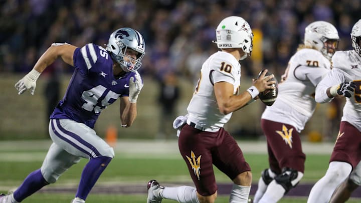 Nov 16, 2024; Manhattan, Kansas, USA; Kansas State Wildcats linebacker Austin Romaine (45) chases Arizona State Sun Devils quarterback Sam Leavitt (10) during the third quarter at Bill Snyder Family Football Stadium. Mandatory Credit: Scott Sewell-Imagn Images