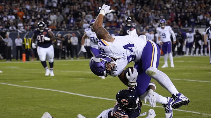 Chicago Bears safety Jonathan Owens (36) makes a tackle on Minnesota Vikings tight end Josh Oliver (84)