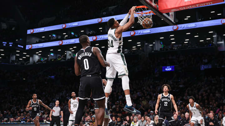 Dec 27, 2023; Brooklyn, New York, USA; Milwaukee Bucks forward Giannis Antetokounmpo (34) dunks the ball in front of Brooklyn Nets forward Dariq Whitehead (0) and forward Jalen Wilson (22) during the second half at Barclays Center. Mandatory Credit: Vincent Carchietta-USA TODAY Sports