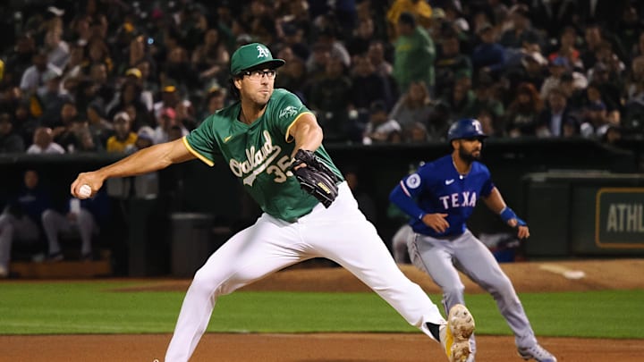 Oakland Athletics relief pitcher Joe Boyle (35) pitches the ball ahead of Texas Rangers second baseman Marcus Semien (2) during the fourth inning at Oakland-Alameda County Coliseum in 2024. Oakland Athletics relief pitcher Joe Boyle (35) pitches the ball ahead of Texas Rangers second baseman Marcus Semien (2) during the fourth inning at Oakland-Alameda County Coliseum in 2024.