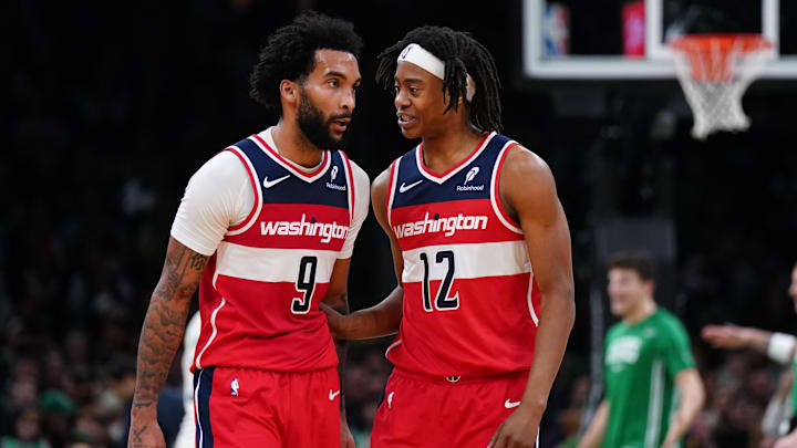 Nov 5, 2025; Boston, Massachusetts, USA; Washington Wizards guard Tre Johnson (12) talks with guard/forward Justin Champagnie (9) as they take on the Boston Celtics in the second half at TD Garden. Mandatory Credit: David Butler II-Imagn Images