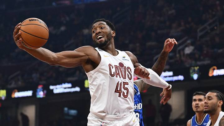 Oct 11, 2026; Cleveland, Ohio, USA; Cleveland Cavaliers guard Donovan Mitchell (45) grabs a rebound during the first half against the Orlando Magic at Rocket Arena. Mandatory Credit: Ken Blaze-Imagn Images