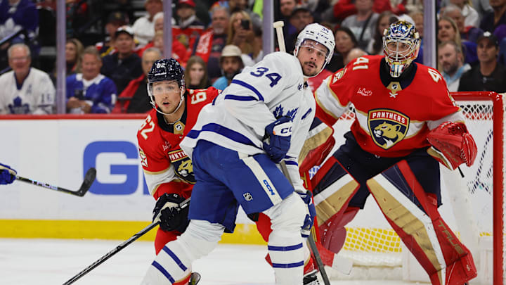 Apr 16, 2024; Sunrise, Florida, USA; Toronto Maple Leafs center Auston Matthews (34) calls for the puck as Florida Panthers defenseman Brandon Montour (62) defends during the third period at Amerant Bank Arena. Mandatory Credit: Sam Navarro-USA TODAY Sports