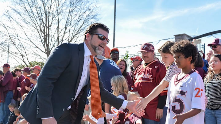 Nov 9, 2024; Blacksburg, Virginia, USA;  Virginia Tech Hokies head coach Brent Pry greets fans before the game against the Clemson Tigers as he enters Lane Stadium. Mandatory Credit: Brian Bishop-Imagn Images