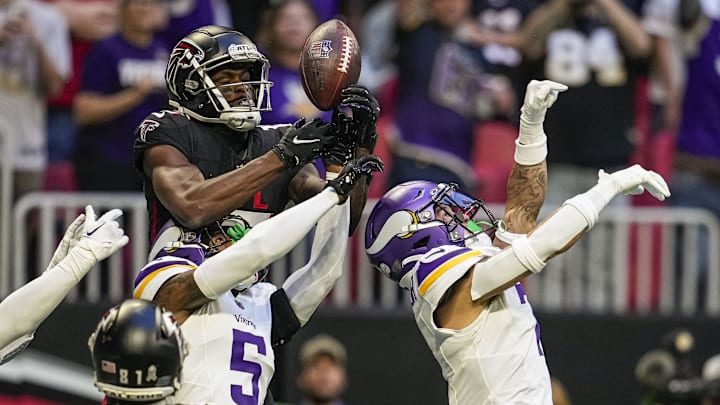 Nov 5, 2023; Atlanta, Georgia, USA; Atlanta Falcons wide receiver Van Jefferson (15) tries to make a catch over Minnesota Vikings cornerbacks Mekhi Blackmon (5) and  Byron Murphy Jr. (7) on the final play of the game  during the second half at Mercedes-Benz Stadium. Mandatory Credit: Dale Zanine-Imagn Images