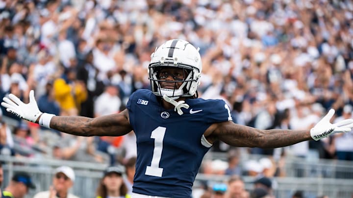 Penn State wide receiver KeAndre Lambert-Smith (1) motions to the crowd after scoring a touchdown on a 57-yard reception late in the fourth quarter of an NCAA football game against Indiana at Beaver Stadium Saturday, Oct. 28, 2023, in State College, Pa. Lambert-Smith's touchdown broke a 24-24 tie and helped seal a 33-24 win for the Nittany Lions.