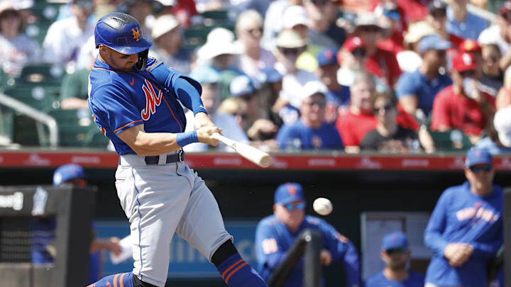Mar 5, 2023; Jupiter, Florida, USA; New York Mets centerfielder Tim Locastro (83) doubles against