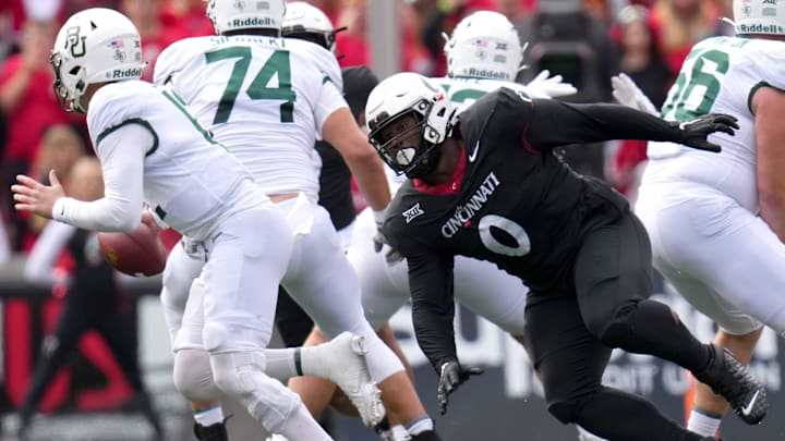 Cincinnati Bearcats defensive end Jowon Briggs (0) pressures Baylor Bears quarterback Blake Shapen (12) in the XX quarter during a college football game between the Baylor Bears and the Cincinnati Bearcats, Saturday, Oct. 21, 2023, at Nippert Stadium in Cincinnati.
