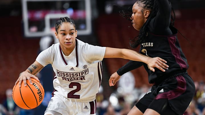 Mississippi State guard Jerkaila Jordan (2) moves the ball past Texas A & M guard Tineya Hylton (3) during the third quarter of the SEC Women's Basketball Tournament game three at the Bon Secours Wellness Arena in Greenville, S.C. Thursday, March 7, 2024.
