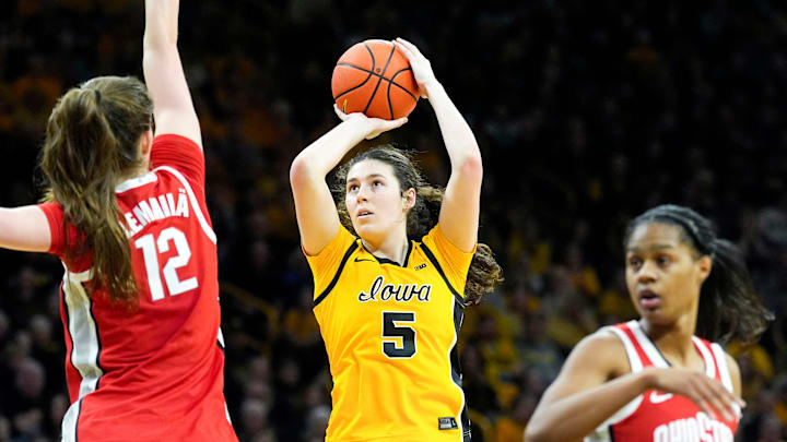 Iowa center Ava Heiden (5) shoots the basketball as Ohio State center Elsa Lemmilä (12) defends Jan. 25, 2026 at Carver-Hawkeye Arena in Iowa City, Iowa.