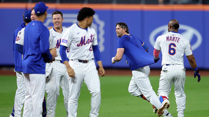 Jun 10, 2025; New York City, New York, USA; New York Mets second baseman Jeff McNeil (1) celebrates his tenth inning walkoff hit against the Washington Nationals with designated hitter Starling Marte (6) at Citi Field. Mandatory Credit: Brad Penner-Imagn Images