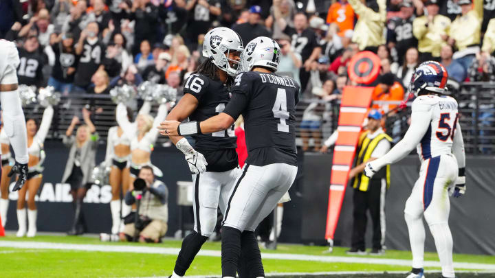 Jan 7, 2024; Paradise, Nevada, USA; Las Vegas Raiders wide receiver Jakobi Meyers (16) celebrates with Las Vegas Raiders quarterback Aidan O'Connell (4) after scoring a touchdown against the Denver Broncos during the first quarter at Allegiant Stadium. Mandatory Credit: Stephen R. Sylvanie-USA TODAY Sports