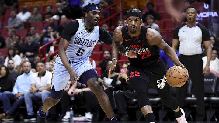Jan 24, 2024; Miami, Florida, USA; Miami Heat forward Jimmy Butler (22) drives to the basket against Memphis Grizzlies guard Vince Williams Jr. (5) during the first quarter at Kaseya Center. Mandatory Credit: Sam Navarro-Imagn Images