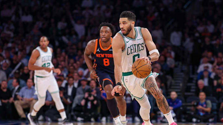 May 12, 2025; New York, New York, USA; Boston Celtics forward Jayson Tatum (0) dribbles up court in front of New York Knicks forward OG Anunoby (8) in the second half during game four of the second round for the 2025 NBA Playoffs at Madison Square Garden. Mandatory Credit: Vincent Carchietta-Imagn Images
